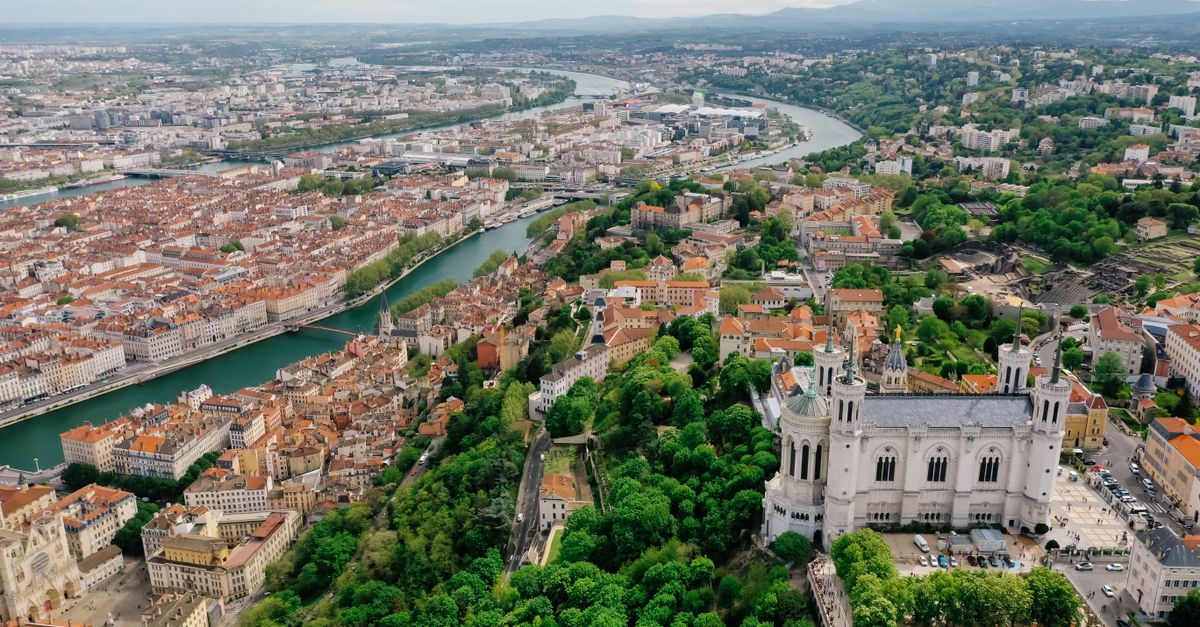 A stunning aerial view of Lyon showcasing the Basilica of Notre Dame and the city's vibrant landscape.
